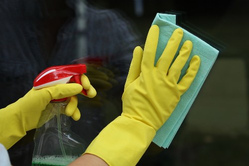 Cleaning team following safe procedures in a workplace environment